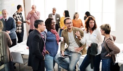 Adults networking at a meeting
