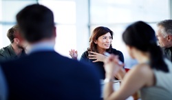 People in discussion during meeting