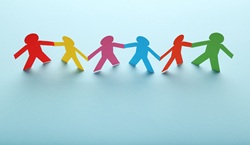 Colourful people made out of paper holding hands.jpg
